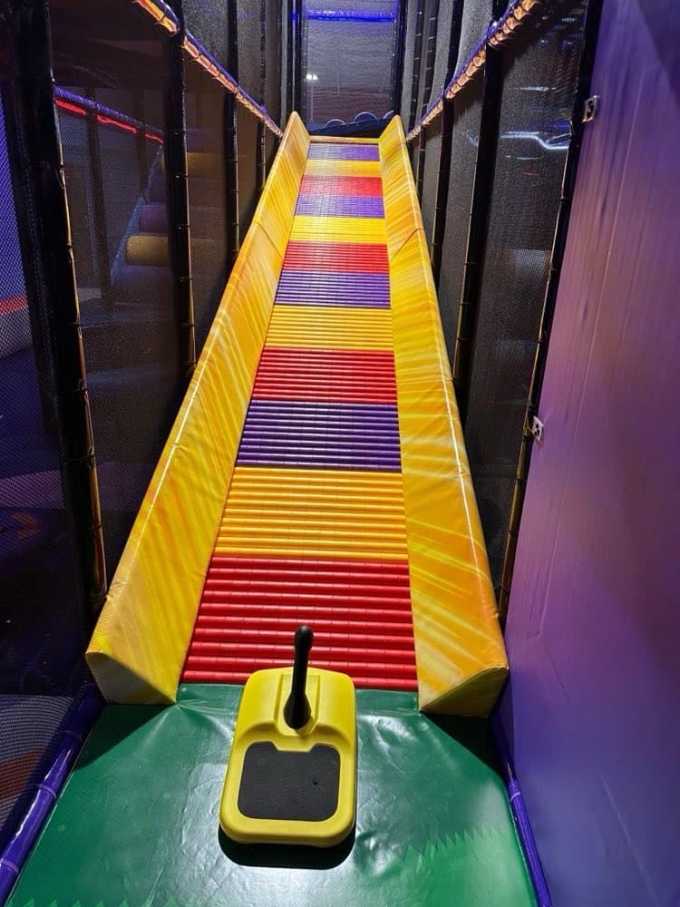 Colorful racing slide at D&R Playland Brooklyn