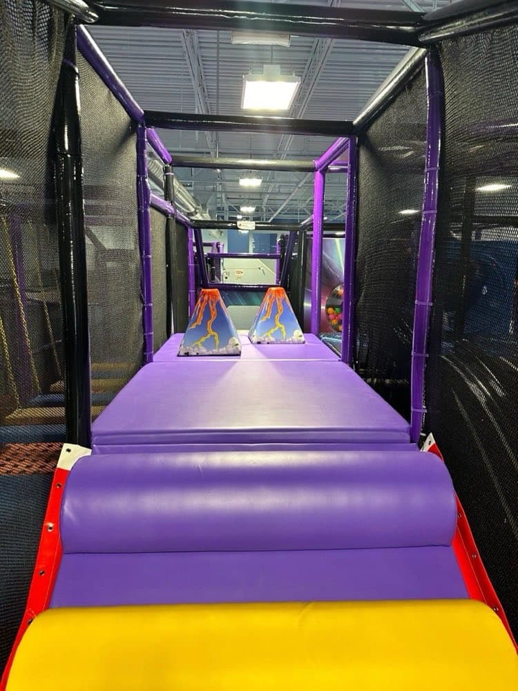 Purple volcano slide play structure at Sheffield Village