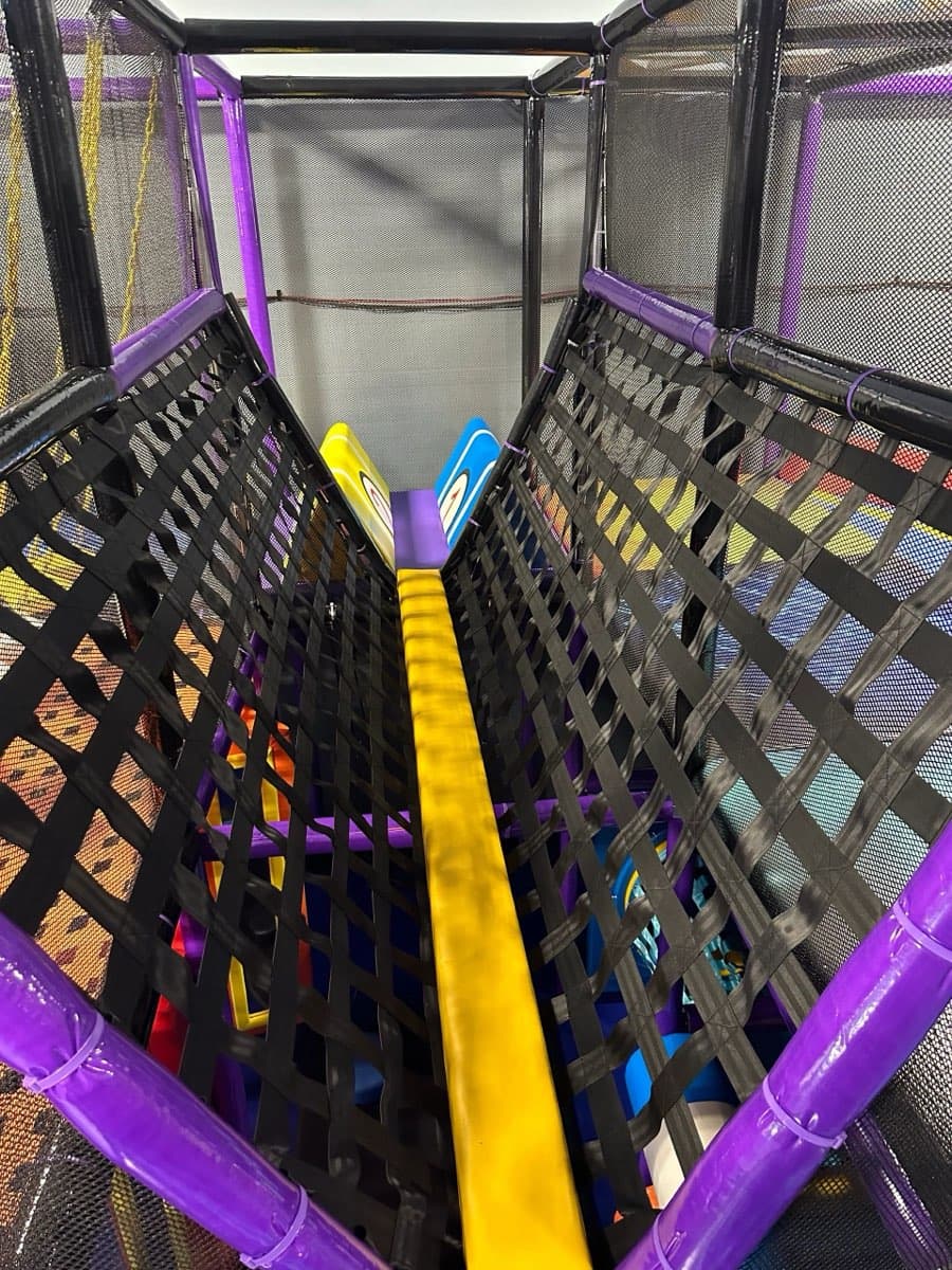 Net bridge walkway inside play structure at Sheffield Village